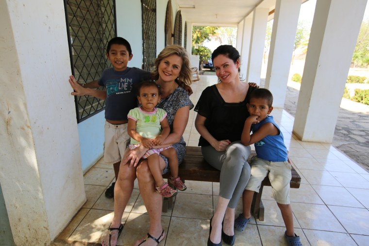 Cynthia McFadden and Karen Spencer with children at a Nicaragua orphanage.