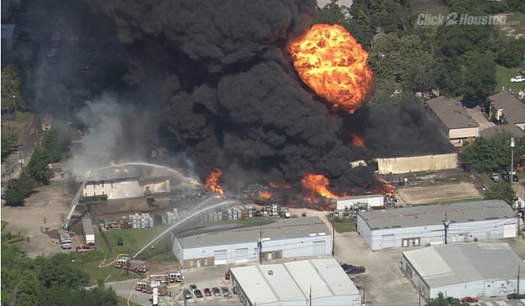 A warehouse fire burns Thursday in Houston.