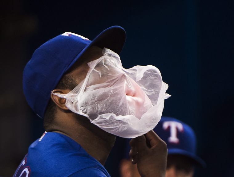 Image: Texas Rangers shortstop Hanser Alberto pops a giant bubble