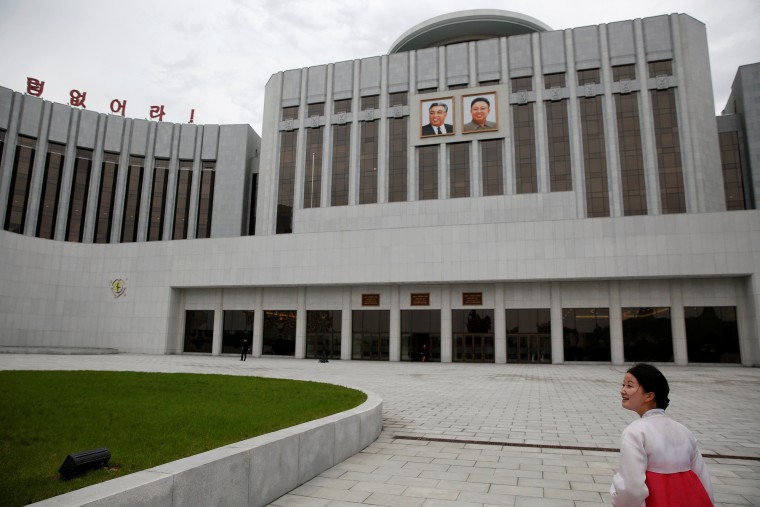Image: A guide leads visitors towards the Mangyongdae Children's Palace in central Pyongyang