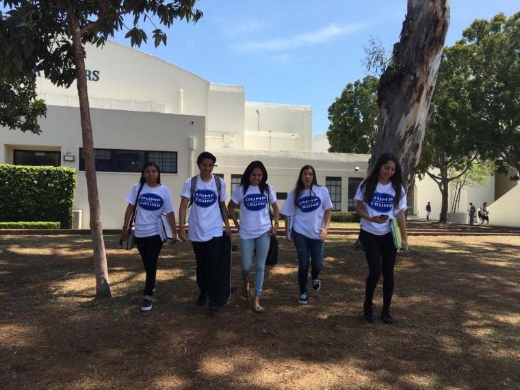 Latino students from Newport Harbor High School in California walk through campus wearing their anti-Donald Trump T-shirts.