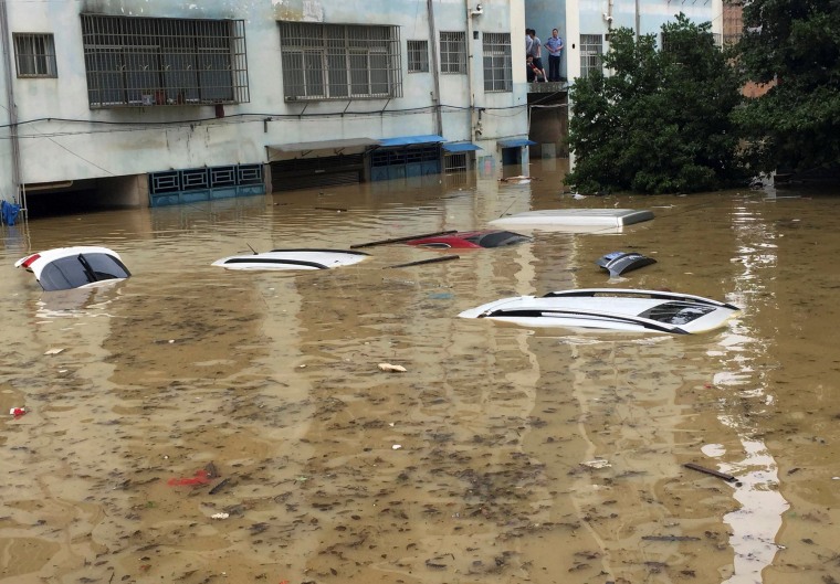 Image: Vehicles are flooded after heavy rainfall in Yongzhou