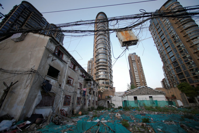 Image: Electric wires hang above a demolished house in Guangfuli neighborhood, Shanghai, China
