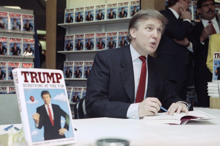 Image: Donald Trump signs copies of his new book in 1990
