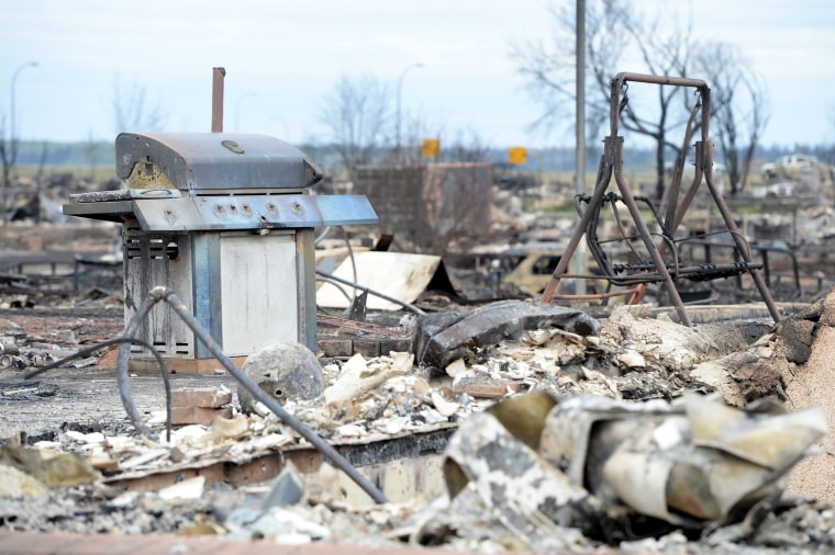 Image: Burned barbecue and swing in Fort McMurray