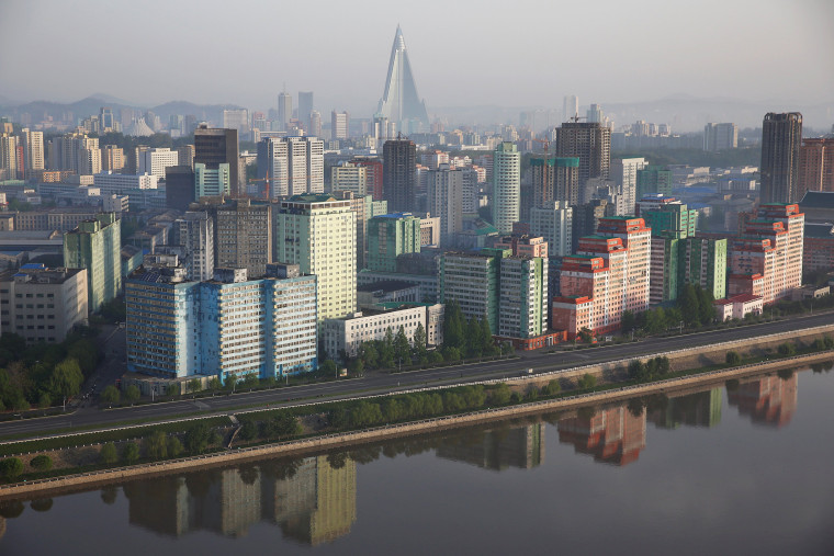 Image: The 105-storey Ryugyong Hotel, the highest building under construction in North Korea, is seen behind central Pyongyang