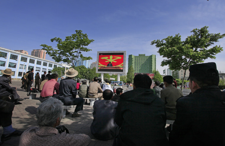 Image: People listen to North Korean leader Kim Jong Un speak at the party congress