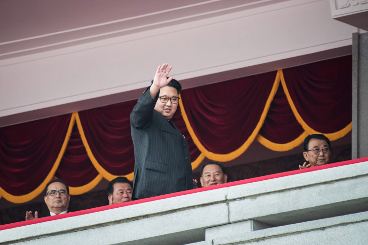 Image: North Korean leader Kim Jong-Un waves from a balcony