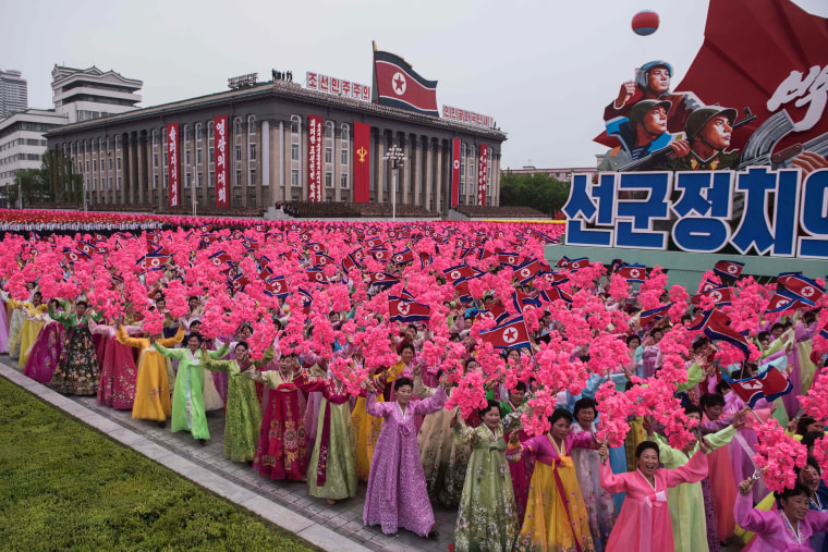Image: Participants take part in a mass parade marking the end of the 7th Workers Party Congress
