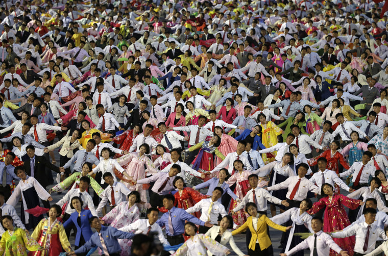 Image: North Korean youth participate in a mass dance party on the Kim Il Sung Square