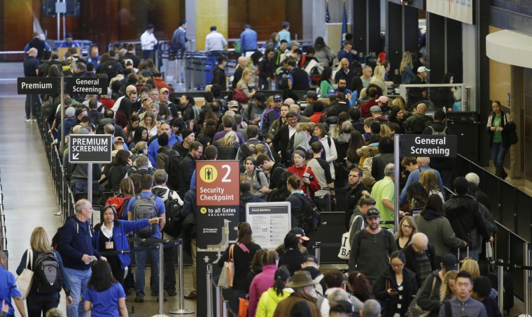 Image: Travelers wait in line for security screening at Seattle-Tacoma International Airport