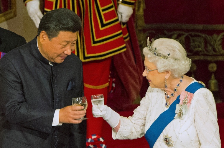 Image: File photo of Chinese President Xi Jinping with Queen Elizabeth II at a state banquet at Buckingham Palace in London
