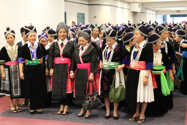 Hmong women in traditional dress attending General Vang Pao's funeral in Fresno California in 2011.