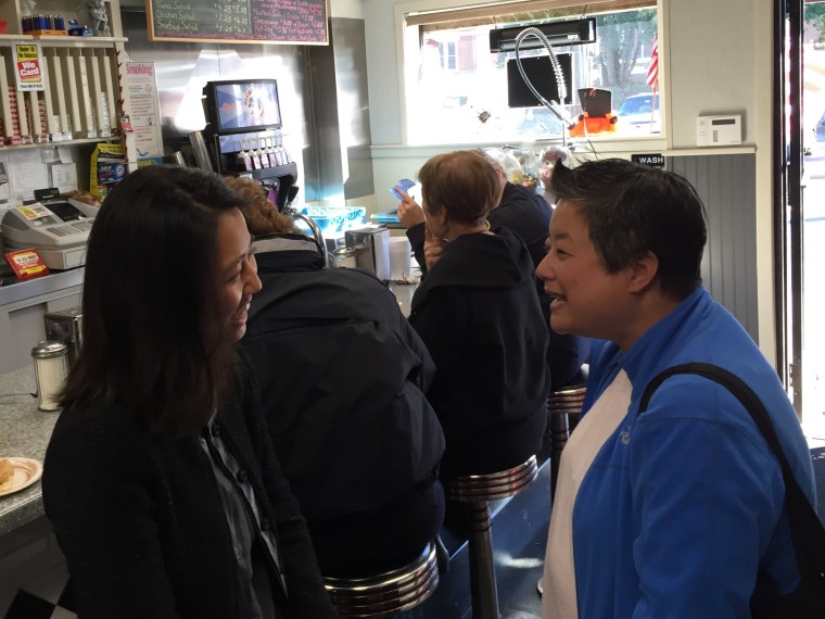 Boston City Councilor At-Large Michelle Wu speaks with a constituent during her office hours at a restaurant in Boston's Hyde Park neighborhood in October 2015.