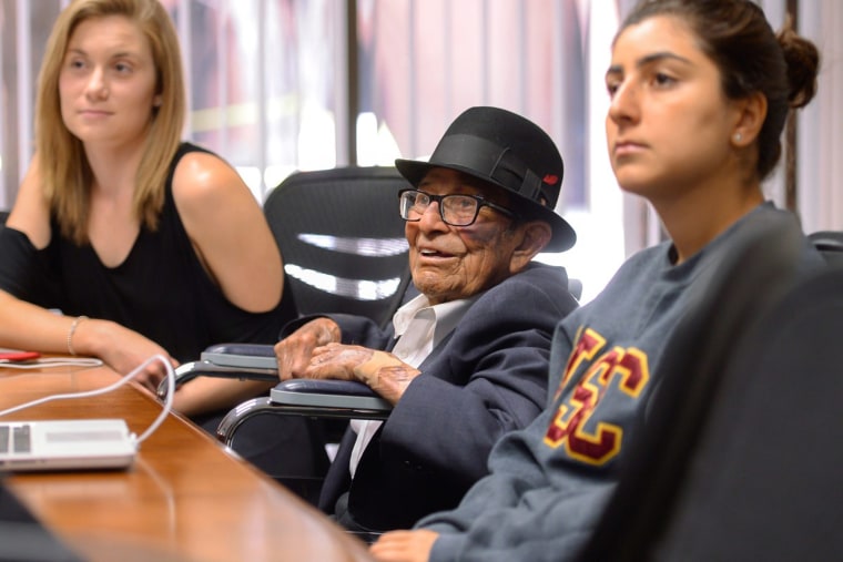 Alfonso Gonzales finishes up his last class in autographical writing at the USC Davis School of Gerontology as he answers questions from classmates Kelsey Reinhardt, left, and Rita Chakrian.