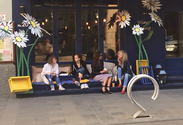 Patrons sit outside a cafe in central Moscow.