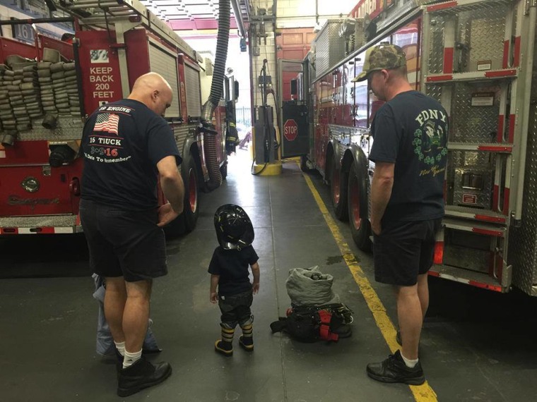 Toddler with firefighters