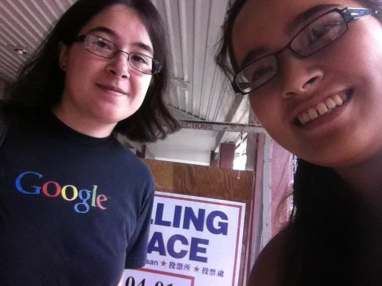 Frances Kai-Hwa Wang's daughters, Mango and Hao Hao, take a selfie for her while voting together