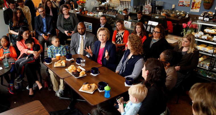 Image: Democratic presidential candidate Hillary Clinton holds a discussion with women and families on work-life balance and family issues during a visit to a cafe in Stone Ridge