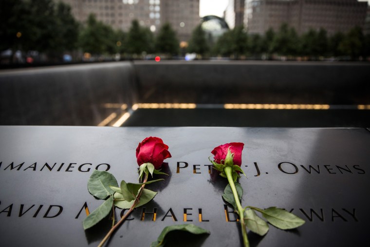 Image: Flowers are laid at the 9-11 Memorial site
