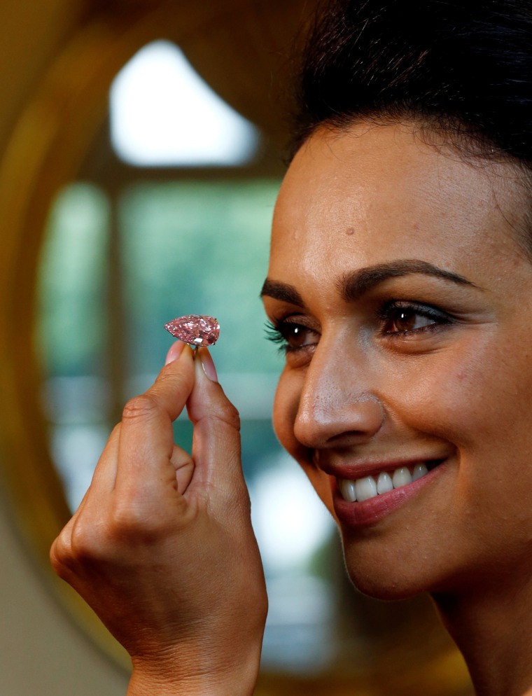 Image: A model poses with the "Unique Pink" at Sotheby's auction house in Geneva