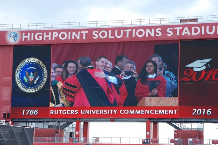 Matt Panconi, Rutgers student body president, is hugged by President Obama at commencement.