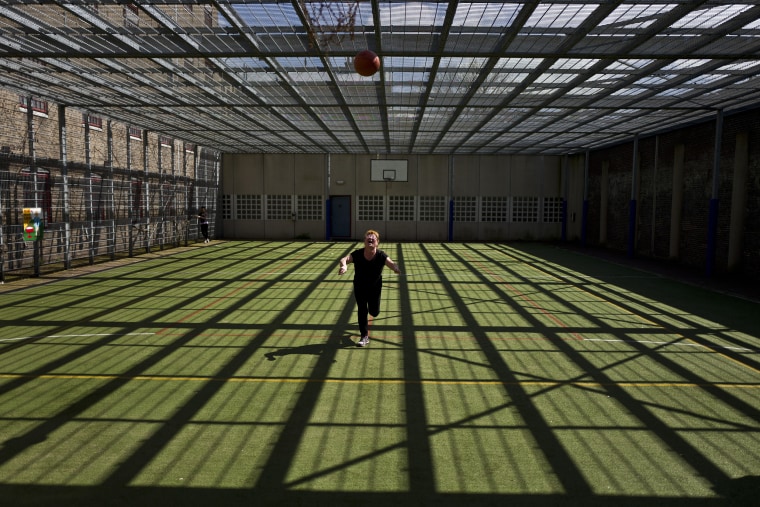 Image: Mongolian migrant Naaran Baatar, 40, plays basketball at a yard of the former prison of De Koepel