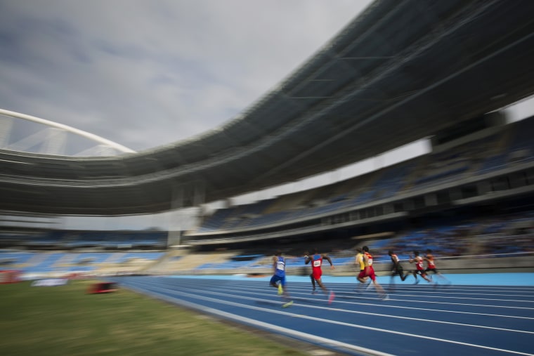 Image: Men compete in a test event at the Rio Olympic Stadium