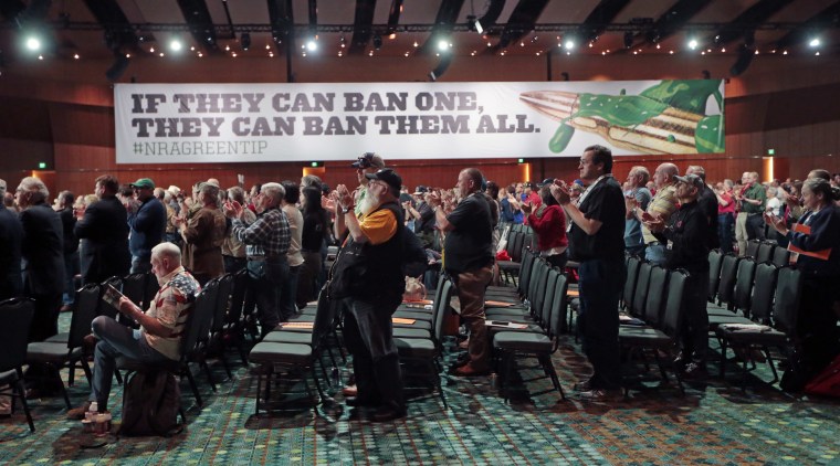 National Rifle Association members applaud a speech during the annual meeting of members at the NRA convention Saturday, April 11, 2015, in Nashville, Tenn.