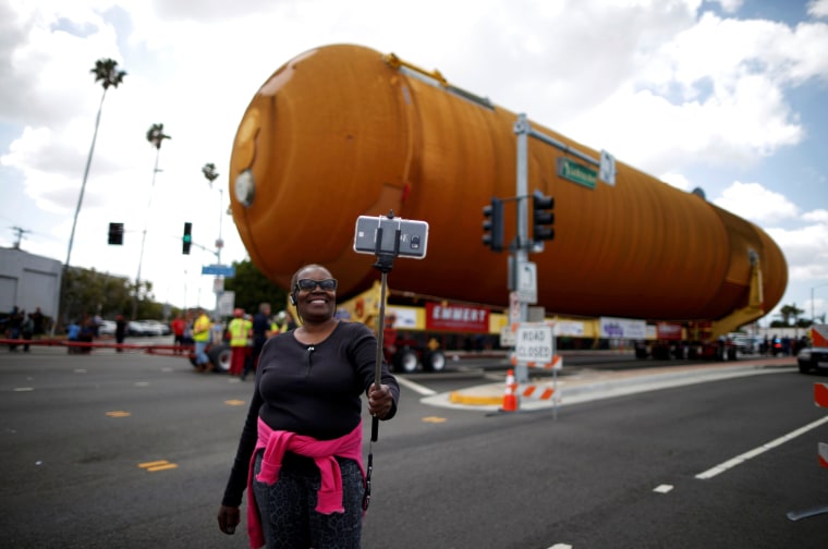 Image: Eddye Chapman takes a picture of herself as the space shuttle Endeavour's external fuel tank