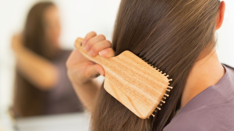 Woman brushing hair