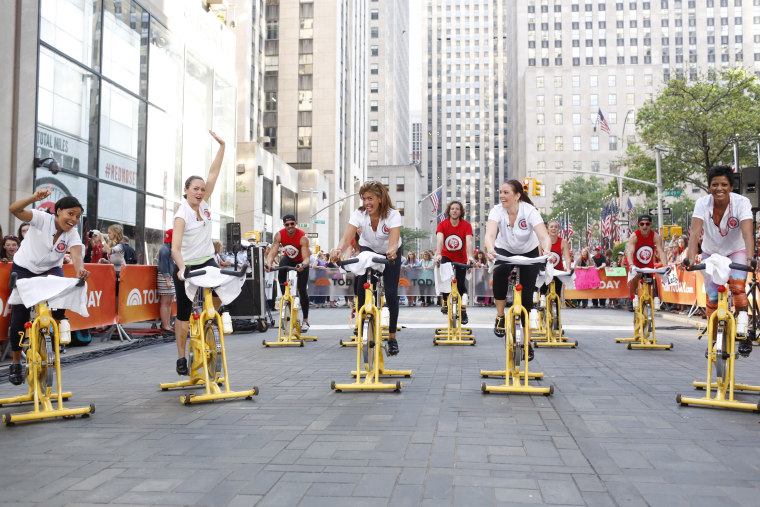 Sheinelle Jones, Dylan Dreyer, Hoda Kotb, Erica Hill and Tamron Hall bike for Red Nose Day on the TODAY plaza
