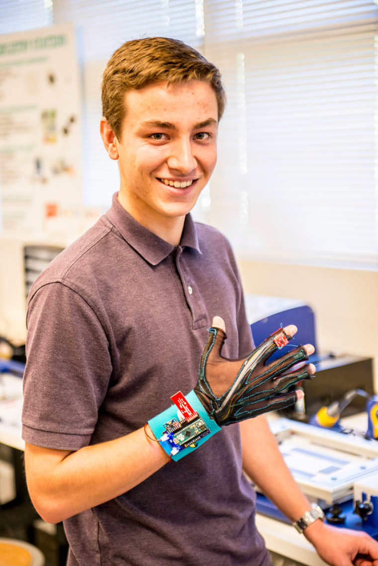 Pre-engineering sophomore Thomas Pryor demonstrates the SignAloud gloves that won a 2016 Lemelson-MIT Student Prize.