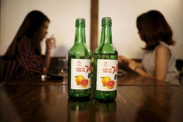 Bottles of fruit flavoured and low-alcohol soju are seen in this picture illustration at a pub in Seoul