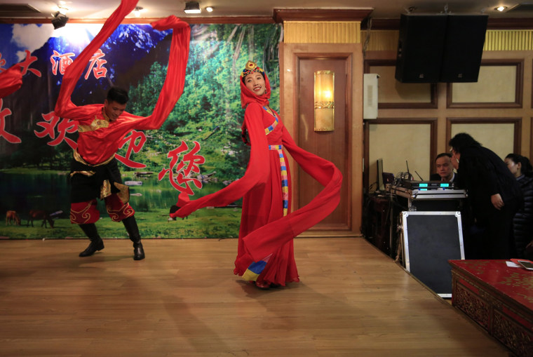 Image: Tibetan dancers perform a traditional dance