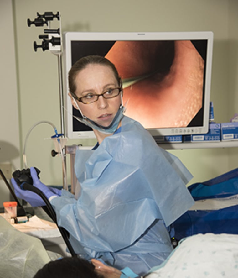 Dr. Shelby Sullivan, MD, inserts an endoscope into the mouth of a patient, routing a balloon to the stomach. There it is inflated to give the patient the feeling of being full after eating.