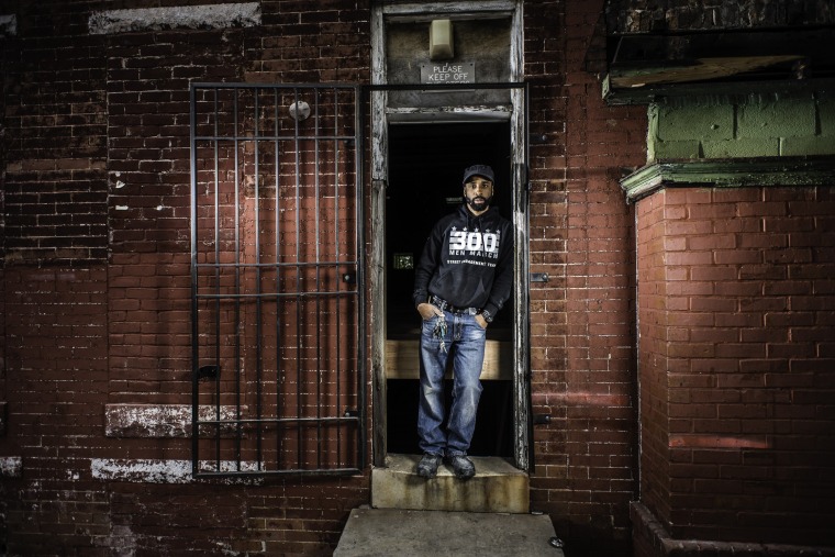 Munir Bahar is the co-founder of the 300 Men March Movement, which promotes anti-violence efforts in Baltimore through community walks. He's pictured in front of the new headquarters of the COR Health Institute, a community development facility being built in East Baltimore that is scheduled to open in July 2016.
