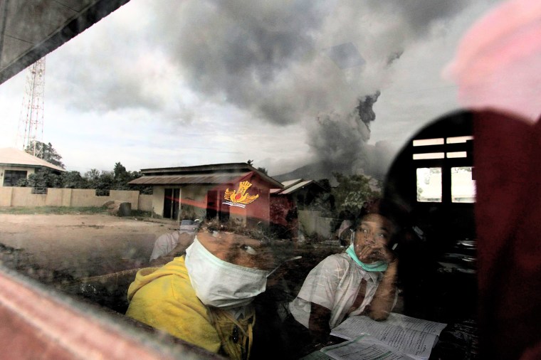 Image: Primary school children wear masks while studying in the classroom