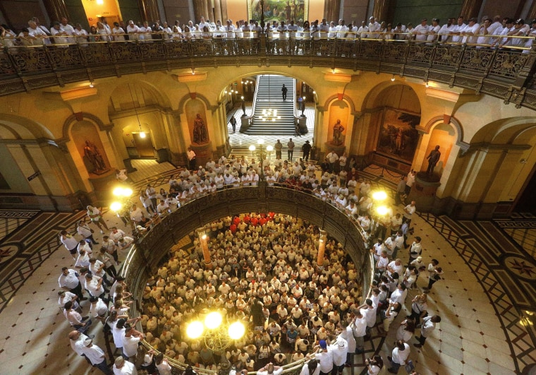 Image: Supporters of nuclear and solar energy rally in the rotunda at the Illinois State Capitol