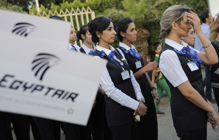 Image: EgyptAir workers line up during a candlelight vigil