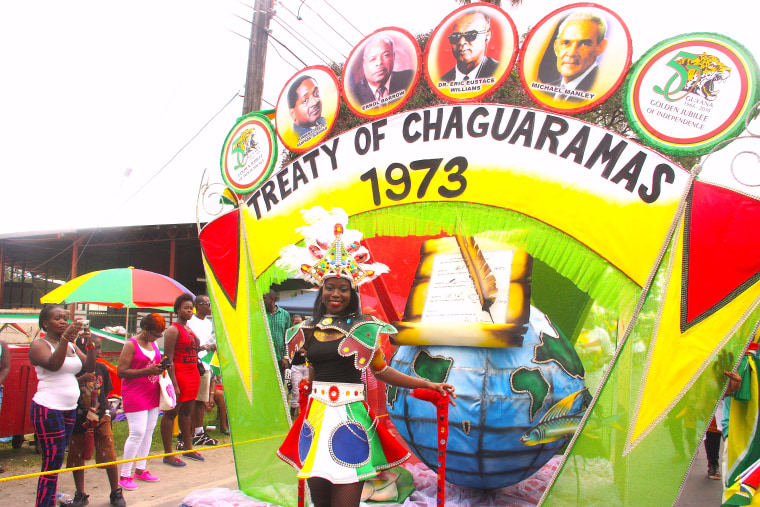 Guyanese songstress Lisa Punch parades through the streets in a costume that represents an important part of Guyana's history. Guyana was one of first four countries to sign the Treaty of Chaguaramas in 1973, which established the Caribbean Community and Common Market, known as CARICOM.