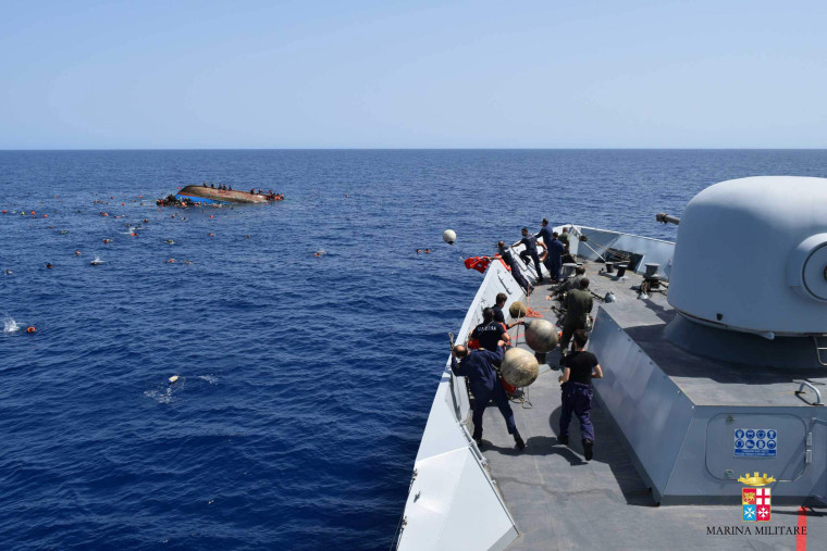 Image: TOPSHOT-ITALY-REFUGEE-IMMIGRATION-SHIPWRECK-RESCUE