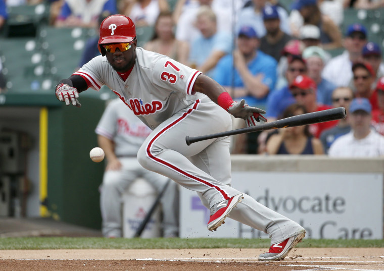 Image: Philadelphia Phillies' Odubel Herrera bunts for a single during the first inning of a baseball game against the Chicago Cubs