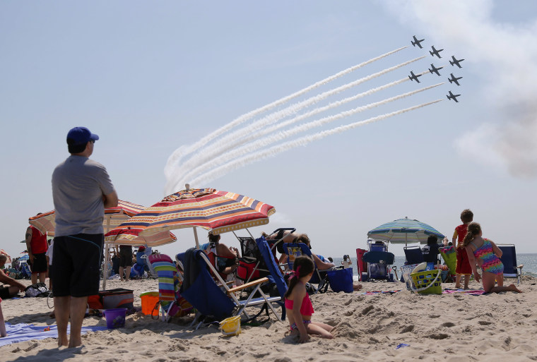 Image: Spectators watch the Breitling Jet Team perform over Jones Beach