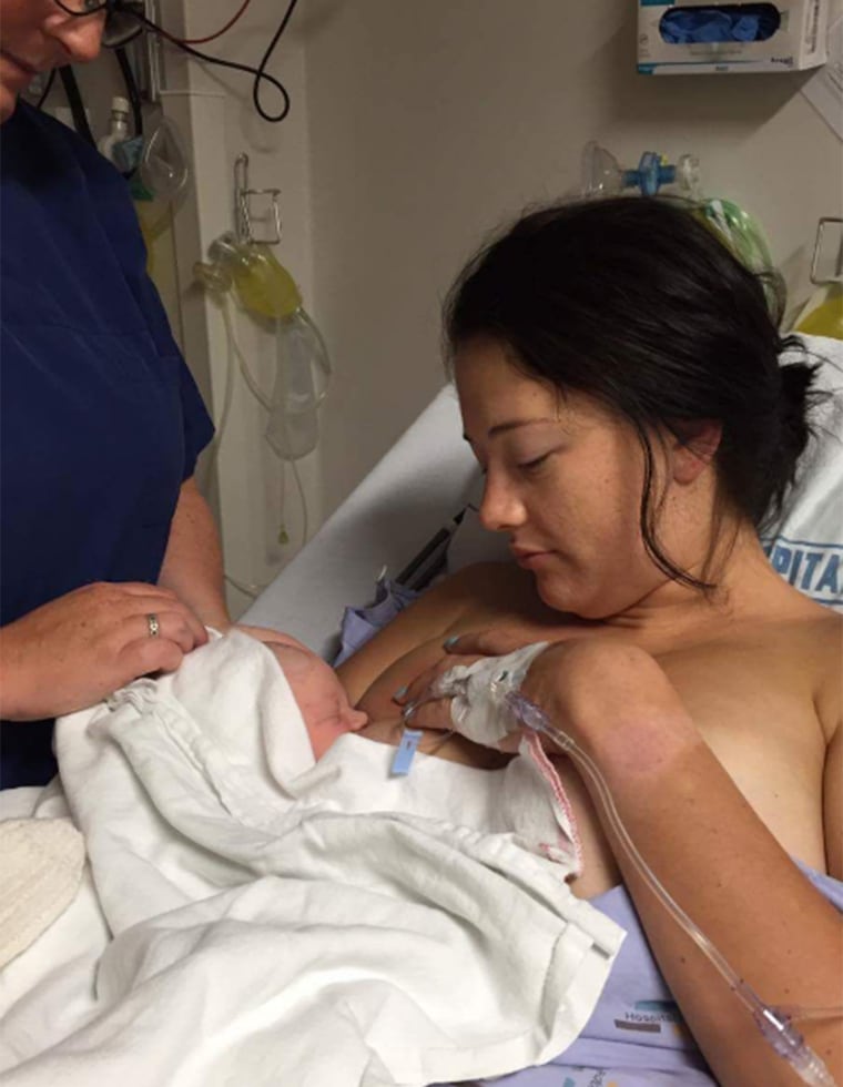 Briar McQueen breastfeeding her son in the hospital.
