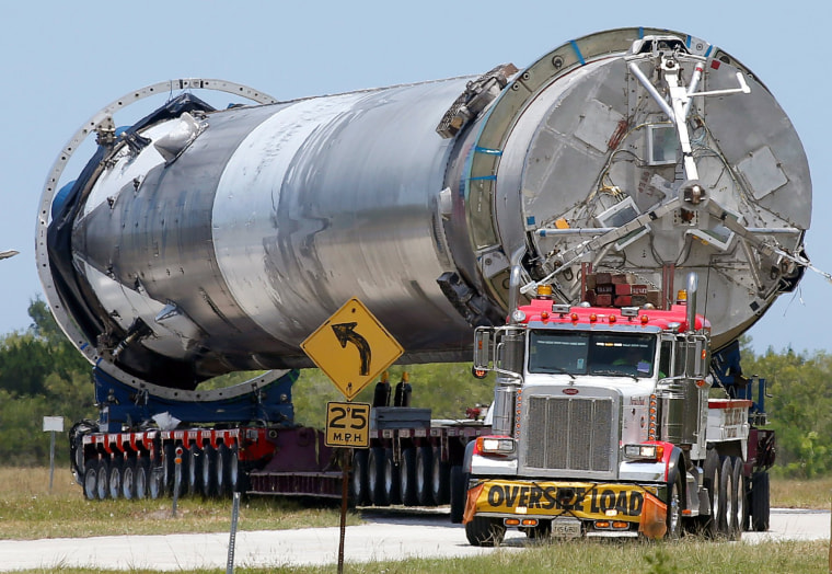 Image: The recovered first stage of a  SpaceX Falcon 9 rocket is transported to the SpaceX hangar at launch pad 39A at the Kennedy Space Center in Cape Canaveral