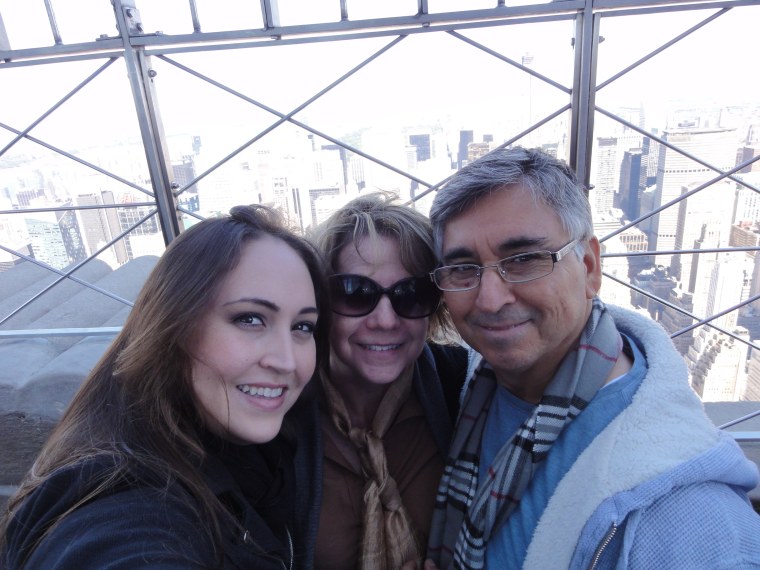 Linda and Sixto Valdez raised their daughter, Lucy, to be bilingual and to honor both of their cultures. Here, they are photographed at the Empire State Building in New York.