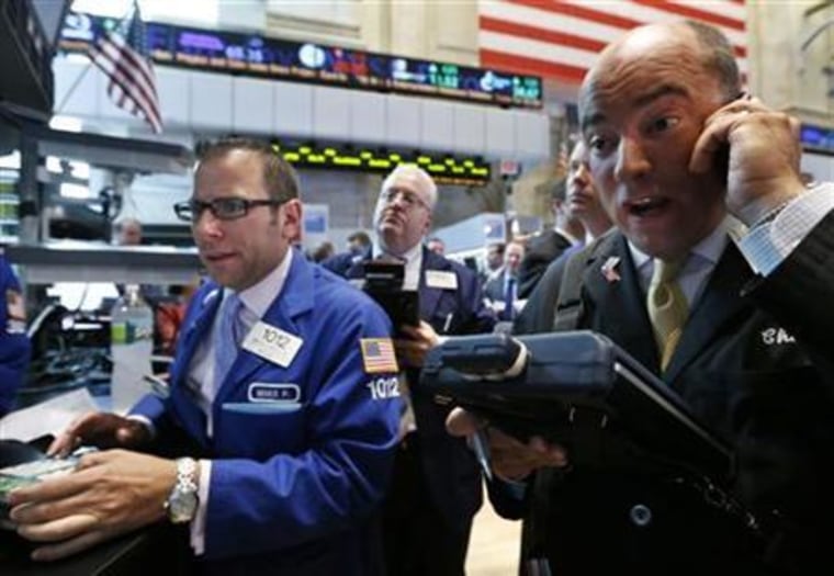 Traders work on the floor of the New York Stock Exchange