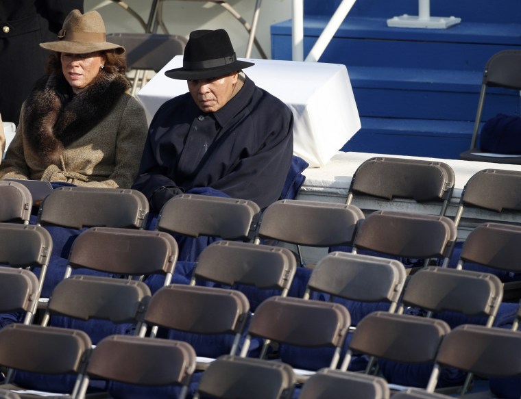 Image: Muhammad Ali sits with his wife Yolanda as they await the inauguration ceremony of Barack Obama as the 44th President