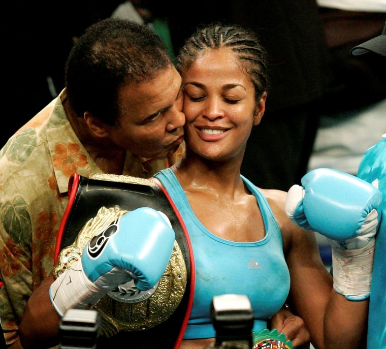 Image: Laila Ali is kissed by her father, boxing great Muhammad Ali